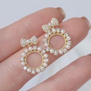 Brand new Imitation pearl bowtie stud woman earrings